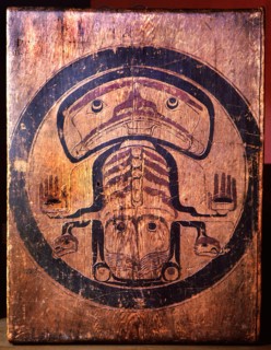 Detail of a box drum which would have been suspended from the house rafters when in use, with a killer whale design painted on both sides