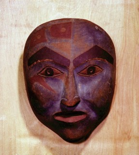 Wooden mask in the form of a human face