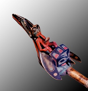 Shamans rattle shaped like a raven with the figure of a shaman on its back