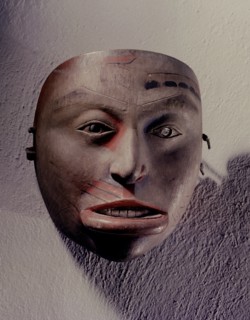 Shamans mask in the form of a womans face with inset mouth