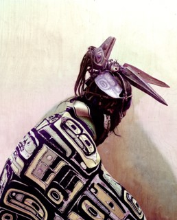 Model of a dancer dressed in cloak and ceremonial headdress