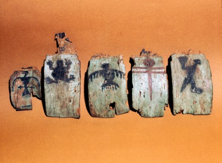 Fragmentary wooden sections from a shamans headdress, painted with images including a frog and two birds