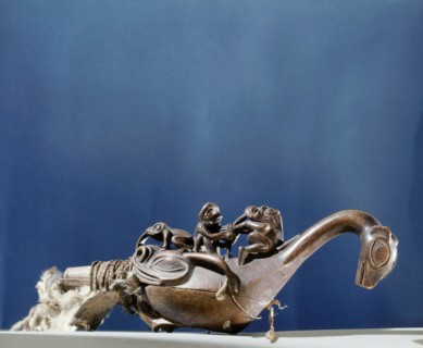 Shamans rattle in the form of a bird or sea monster with a shaman torturing a witch on its back