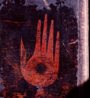 Detail of a shamans storage chest,decorated with a hand symbol