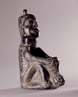 Stone human figure bowl, thought to have been used by Salish shamans in purification rites as part of ceremonies marking the onset of female puberty