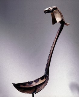 Ladle with a raven perched on the handle