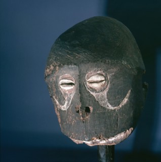 Head of a wooden figure, with inset shell eyes