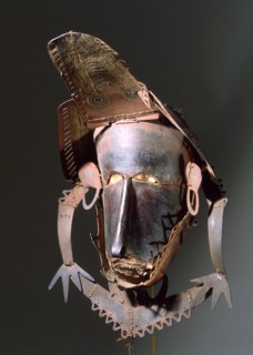 Torres Straits dance mask made from thin sheets of tortoise shell sewn together with palm fibres