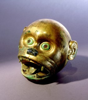 Gold monkey head bead which is typical of the elaborate funerary goods buried with Mochica nobility