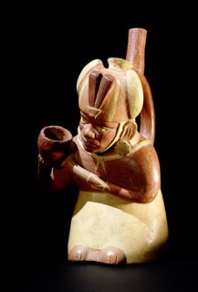 Stirrup spouted Mochica portrait jar depicting a noble pouring out water or chicha beer, probably as a libation associated with fertility rituals