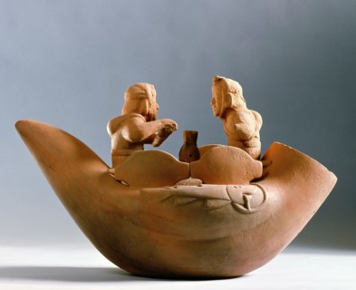 Hollow effigy jar depicting two Mochica fisherman sitting on a reed raft