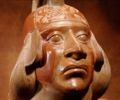 Stirrup spouted Mochica portrait jar depicting a face of a nobleman