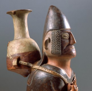 Detail of an effigy ceramic showing a male figure carrying the typical Inca aryballus on his back