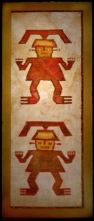 Ceremonial poncho with two central figures embroidered in coloured llama wool onto a cotton base