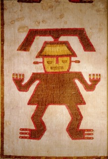 Detail of a ceremonial poncho with a figure embroidered in coloured llama wool onto a cotton base