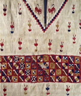 This Inca poncho, with interlocking designs, depicts plants and felines