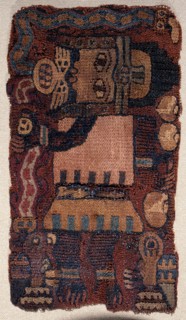 The oculate being in his human form, wearing a typically Paracas style golden diadem and holding a trophy headed snake