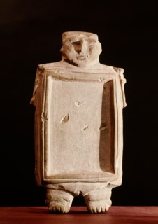 A flat dish modelled in the form of a nude woman