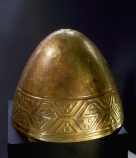 A gold cup in the form of a female breast