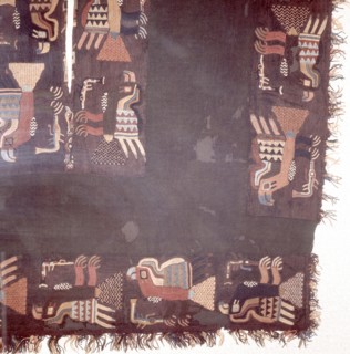 Fragment of black textile, embroidered with a menagerie of different coloured birds