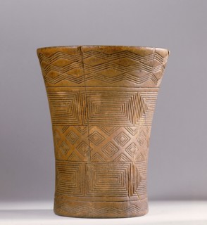 This Andean kero or ritual drinking vessel is decorated with Inca geometric designs