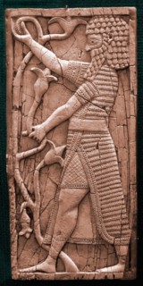Fragment showing a warrior in ceremonial dress holding a lily
