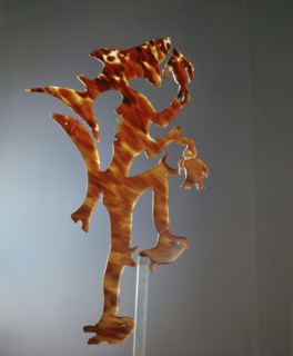 A complex tortoise shell low relief carving thought to represent a sea spirit