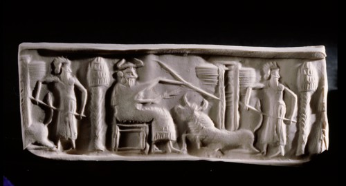 Modern impression of an Akkadian cylinder seal inscribed with a scene of a seated deity wearing horned headdress, with attendant and a recumbent bull supporting a winged gate