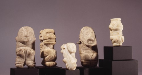 Miniature amulets of crouching dogs