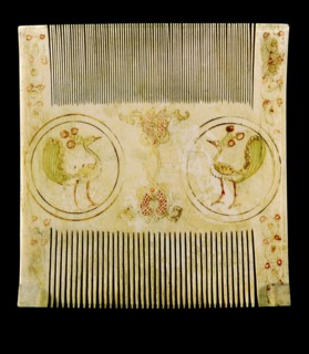 An ivory comb with painted decoration which was made by Sicilian Muslims for Christian patrons