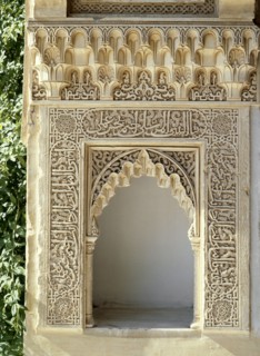 Elaborately carved niche with calligraphic and other stucco decoration