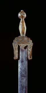 A very rare ceremonial iron sword with brass pommel