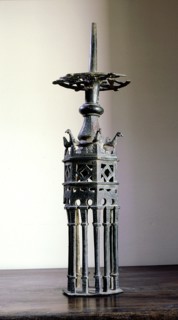 A hexagonal candlestick with crenellations like those of the Great Mosque of Cordoba