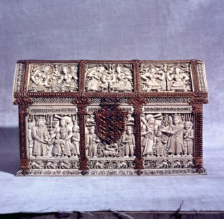 A casket decorated with rubies, gold and sapphires which shows the crowning of a boy prince