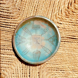 Bowl with faience interior incised with design including lotus buds