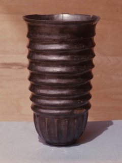 Burnished black ware ribbed pot