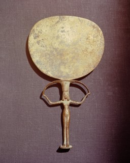Bronze mirror with the handle in the form of a naked woman