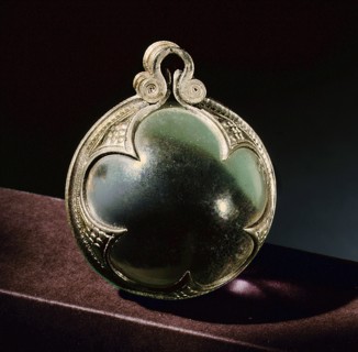 Silver mounted rock crystal sphere, a pendant from a necklace