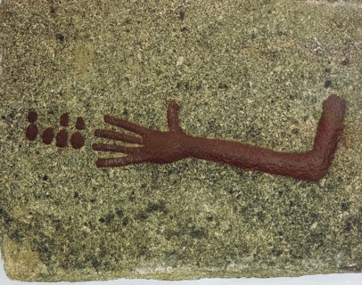 Stone with low relief carving of an arm with seven small discs, perhaps coins or gaming pieces