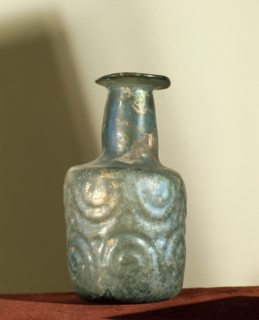 A bottle of irridescent glass