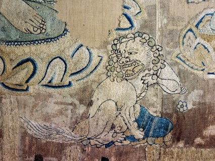 Detail of an embroidered silk banner of the Buddha Sakyamuni preaching on Vulture Peak