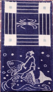 Ikat weaving with a depiction of a man riding a dolphin