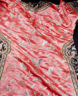 Detail of a dress embroidered with butterfly motifs
