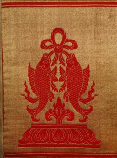 Sino Tibetan silk and gold brocade altar cloth depicting eight auspicious emblems interspersed by puja devis (offering goddesses) who offer gifts to the five Dhyani Buddhas, or Buddhas of meditation