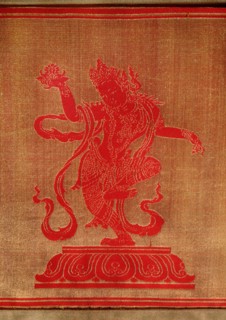 Sino Tibetan silk and gold brocade altar cloth depicting eight auspicious emblems interspersed by puja devis (offering goddesses) who offer gifts to the five Dhyani Buddhas, or Buddhas of meditation