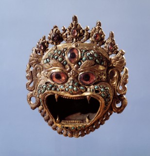 A holy water vessel in the form of a demonic face