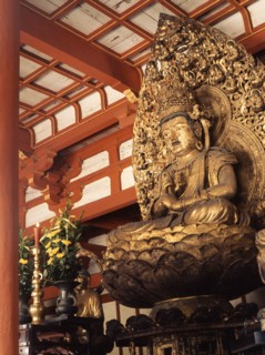 Statue of a Buddha seated on a lotus flower