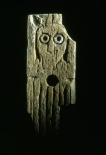 Bone inlay figure, perhaps a furniture inlay, with raised arms in a posture of salutation