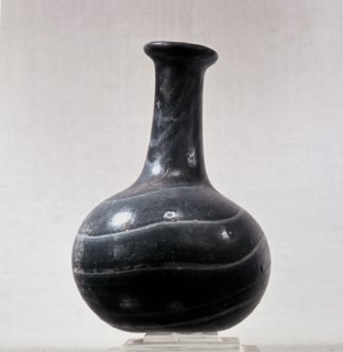 Vases like this are often found in Roman burials filled with perfume for the dead
