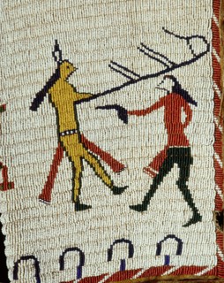 Beadwork decoration on a sleeveless jacket showing fighting between an Indian and a white man